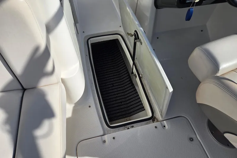 Slide: The Image of 2008 Yamaha Boats AR230 HO interior storage compartment with open hatch and seating. - 18