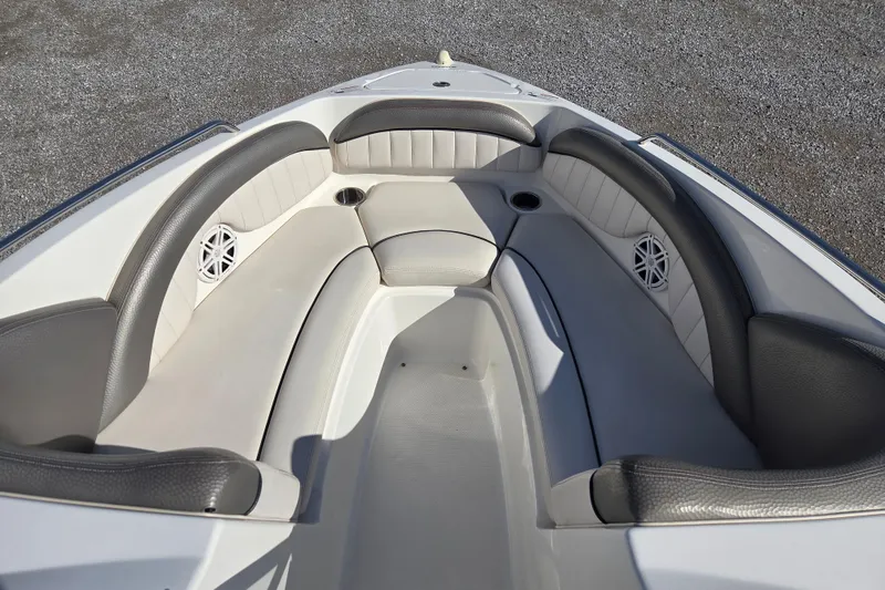 Slide: The Image of 2008 Yamaha Boats AR230 HO bow seating area with gray upholstery and speakers. - 7
