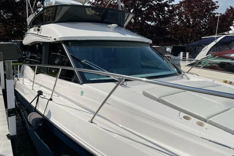 The Image of 2024 Regal 42 Fly yacht on water, featuring sleek design and modern amenities. - 0