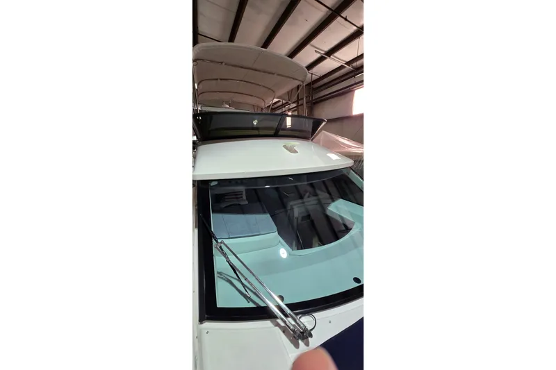 Slide: The Image of 2024 Regal 42 Fly yacht anchor compartment with polished metal fittings. - 10