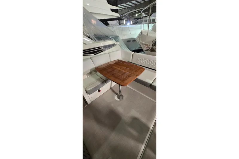 Slide: The Image of Staircase on 2024 Regal 42 Fly yacht, featuring sleek wooden steps and modern design. - 17