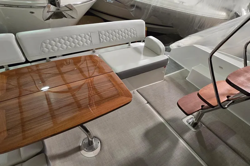 Slide: The Image of 2024 Regal 42 Fly yacht interior with grill and seating area. - 18