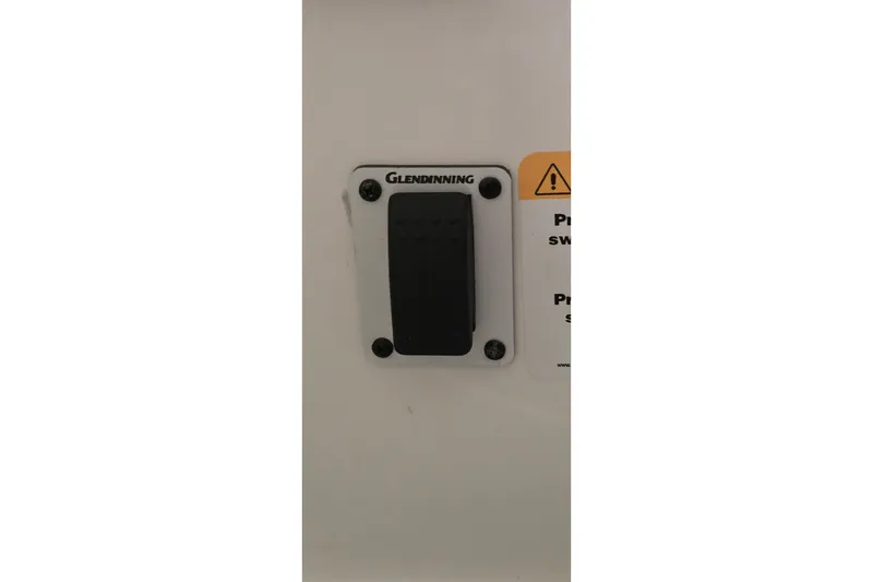 Slide: The Image of 2024 Regal 42 Fly yacht control panel with switches and connectors. - 22