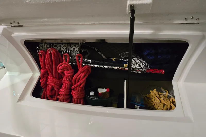 Slide: The Image of 2024 Regal 42 Fly yacht interior in a spacious indoor marina setting. - 24