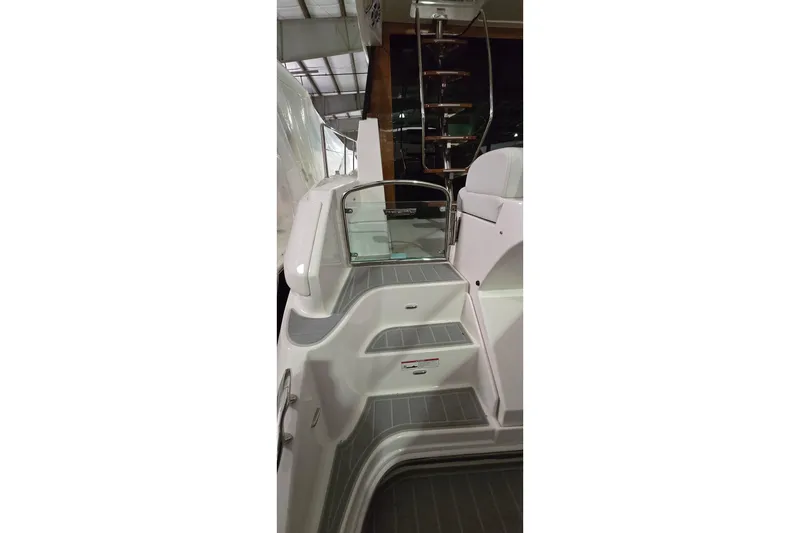 Slide: The Image of 2024 Regal 42 Fly yacht with dual Garmin displays in a marina setting. - 26