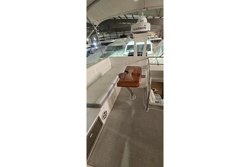 Slide: The Image of 2024 Regal 42 Fly yacht interior with seating, table, and modern amenities. - 34