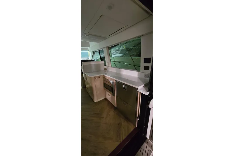 Slide: The Image of Modern kitchen sink in 2024 Regal 42 Fly yacht, featuring sleek chrome faucet. - 50