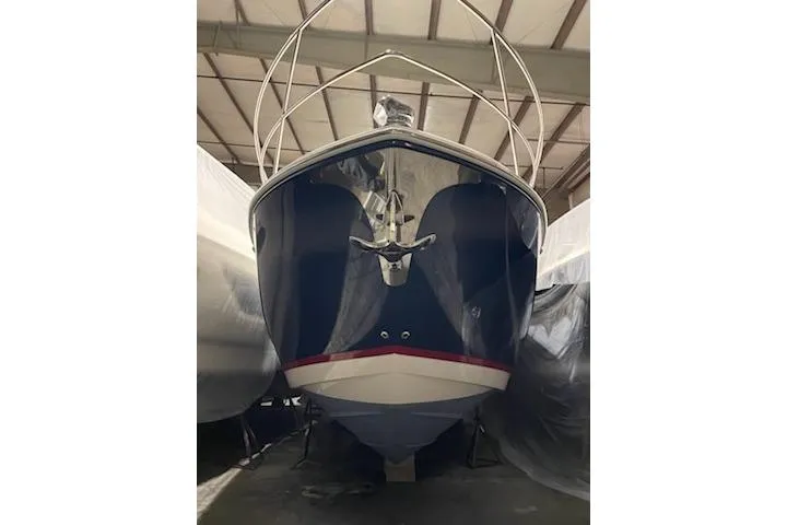 Slide: The Image of 2024 Regal 42 Fly yacht, sleek design with modern railings in a showroom setting. - 7