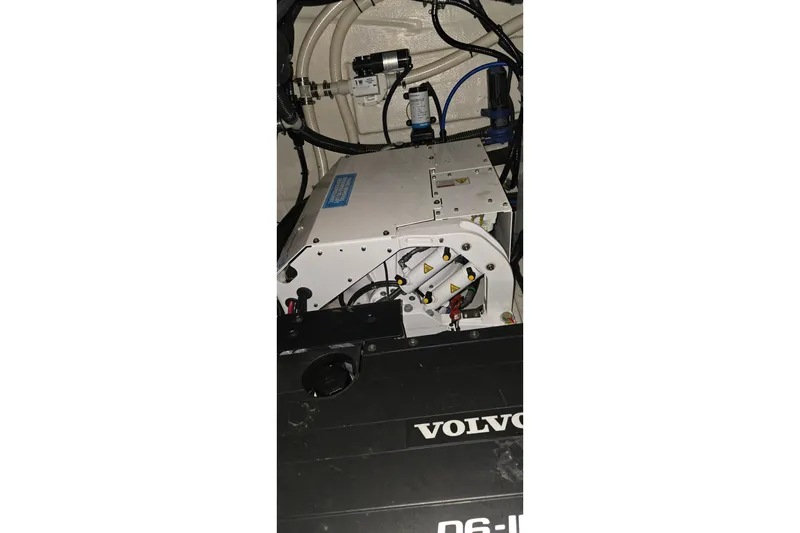 Slide: The Image of Engine room of 2024 Regal 42 Fly yacht, showcasing mechanical components and systems. - 76