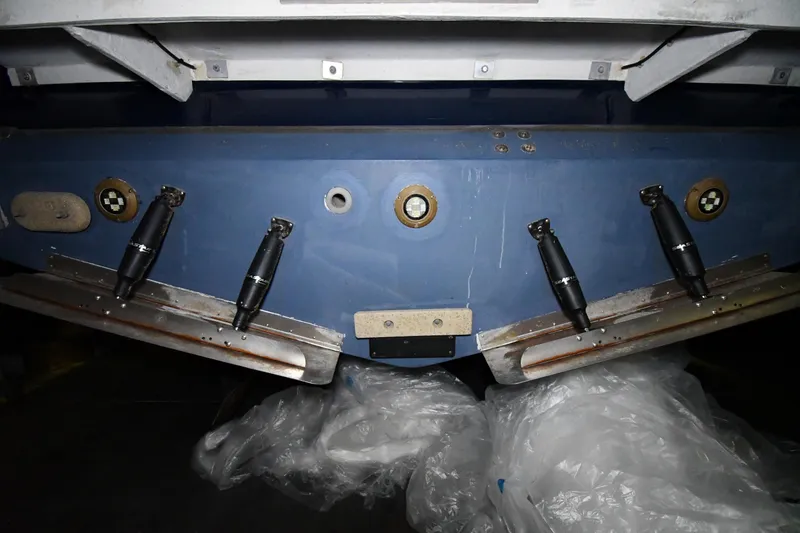 Slide: The Image of 2024 Regal 42 Fly boat hull with trim tabs and underwater fittings. - 93