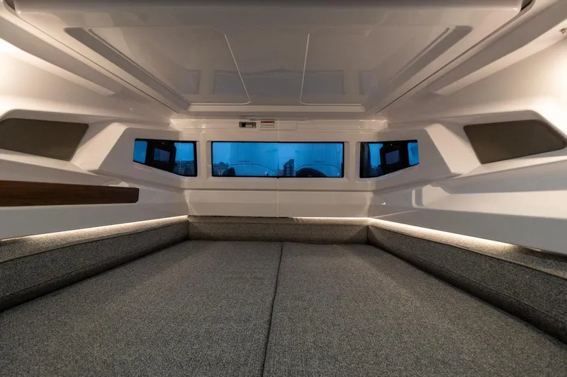 Slide: The Image of 2027 Axopar 38 Cross Cabin interior with modern design and ambient lighting. - 35