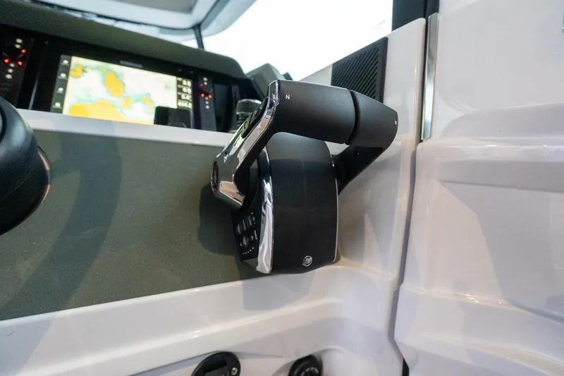 Slide: The Image of Control panel of 2027 Axopar 38 Cross Cabin with navigation display. - 40