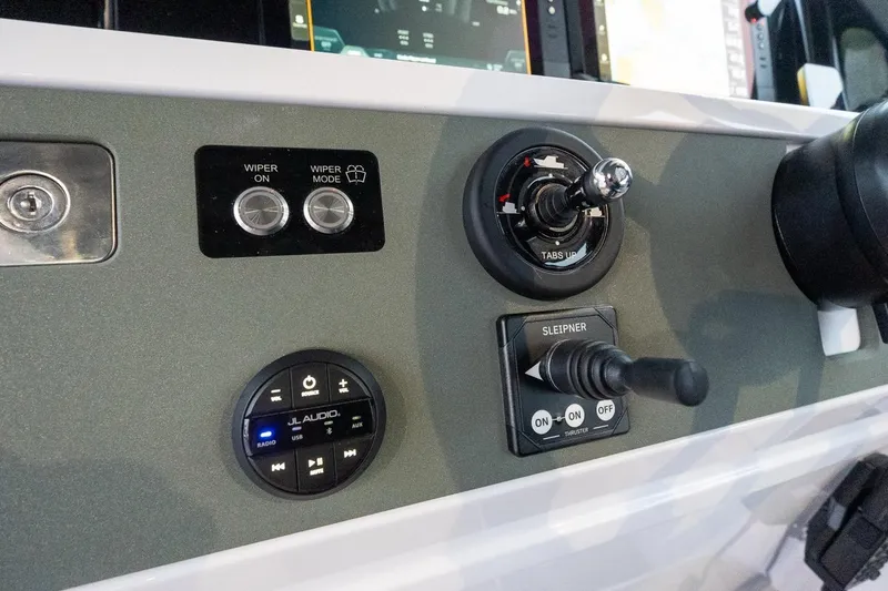 Slide: The Image of Control panel of 2027 Axopar 38 Cross Cabin with audio and wiper controls. - 41