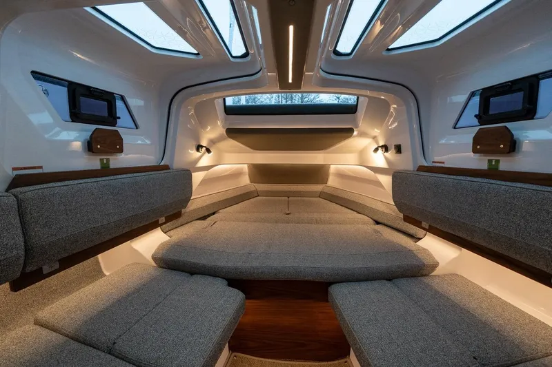 Slide: The Image of Luxurious interior of 2027 Axopar 38 Cross Cabin with modern seating and ambient lighting. - 48