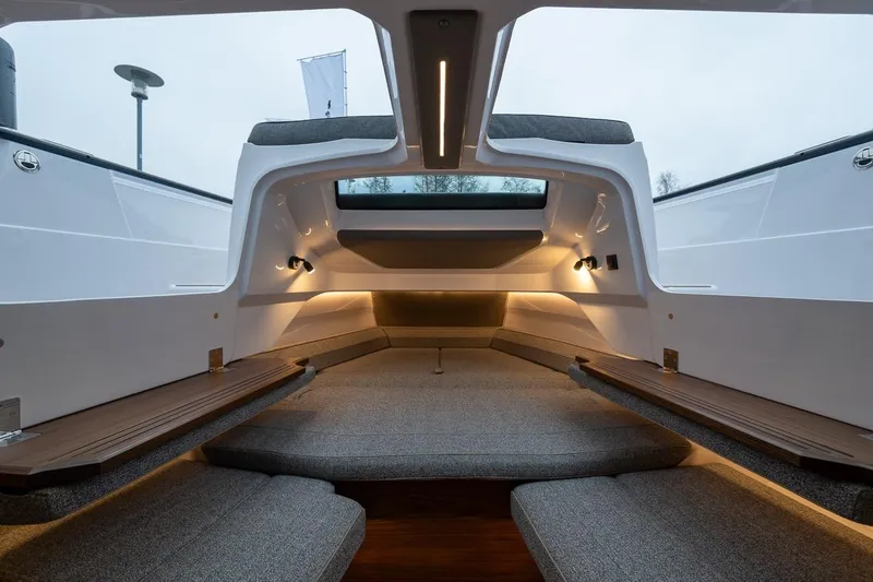 Slide: The Image of Interior of 2027 Axopar 38 Cross Cabin, featuring modern design and ambient lighting. - 52