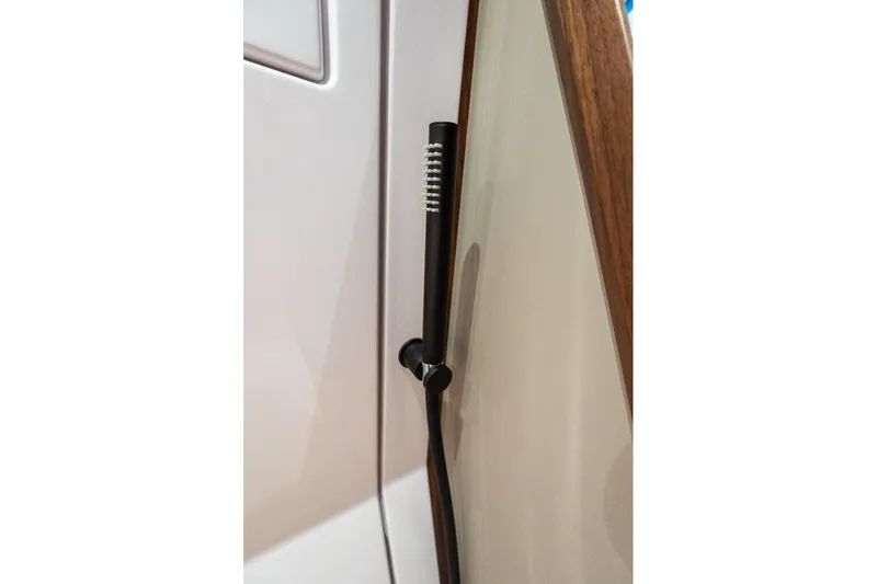Slide: The Image of Close-up of a door handle on a 2027 Axopar 38 Cross Cabin boat. - 58