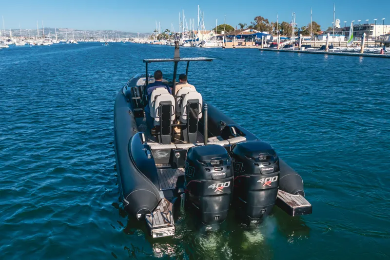Slide: The Image of 2019 Technohull Sea DNA 999 boat with dual 400R engines in a marina setting. - 10