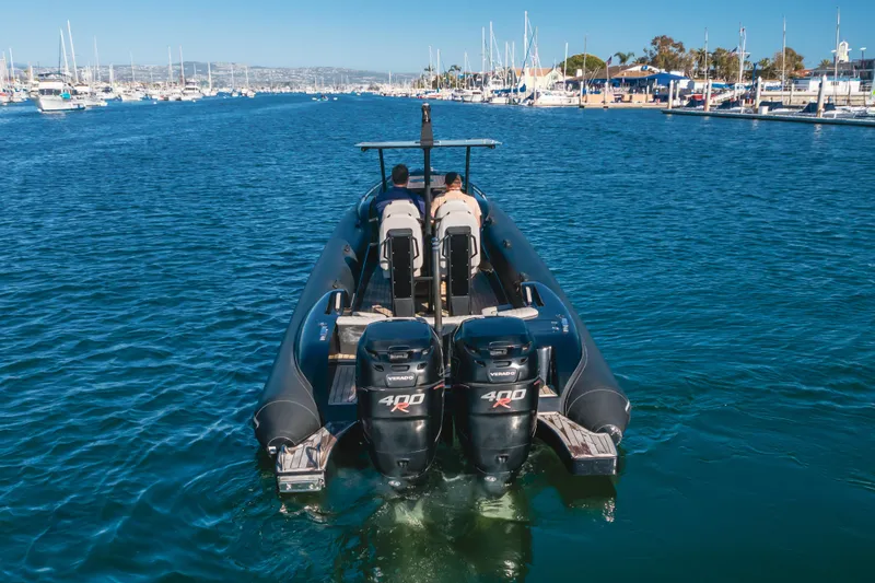 Slide: The Image of 2019 Technohull sea DNA 999 boat with dual 400R engines cruising in a marina. - 11