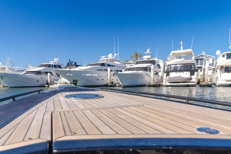 Slide: The Image of 2019 Technohull sea DNA 999 boat deck with yachts in marina background. - 16