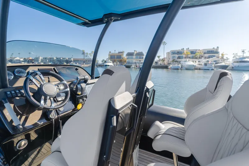 Slide: The Image of 2019 Technohull Sea DNA 999 cockpit with luxurious seating and marina view. - 23