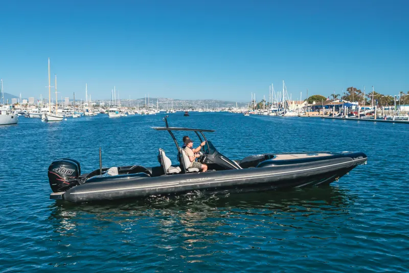 Slide: The Image of 2019 Technohull Sea DNA 999 boat cruising in a marina with clear blue skies. - 3