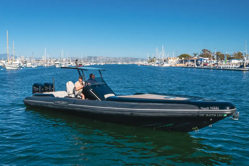Slide: The Image of 2019 Technohull Sea DNA 999 boat cruising in a marina under clear blue skies. - 4
