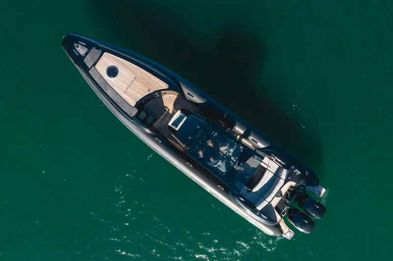 Slide: The Image of Aerial view of 2019 Technohull sea DNA 999 boat on clear water. - 6