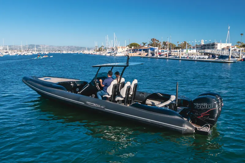 Slide: The Image of 2019 Technohull Sea DNA 999 boat cruising in a marina with clear blue water. - 8