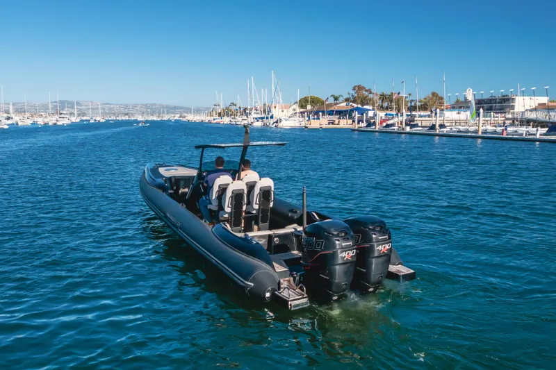 Slide: The Image of 2019 Technohull Sea DNA 999 boat cruising in a marina with twin 400 engines. - 9