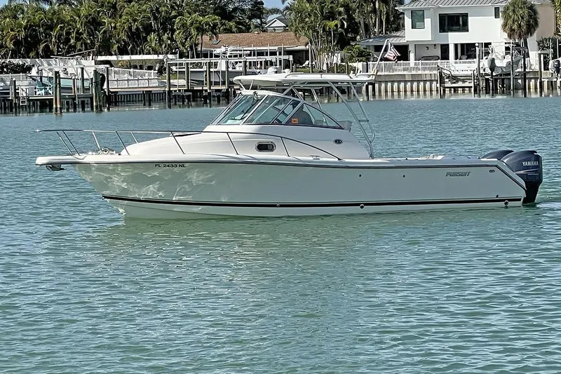 The Image of 2007 Pursuit OS 285 Offshore boat on calm water near a dock. - 0