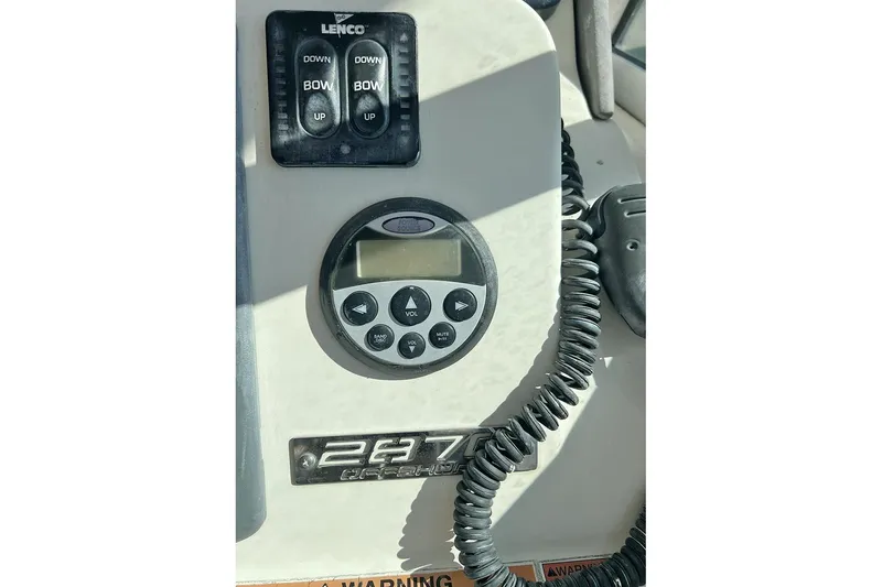 Slide: The Image of Control panel of a 2007 Pursuit OS 285 Offshore boat with Lenco trim tab switches. - 10