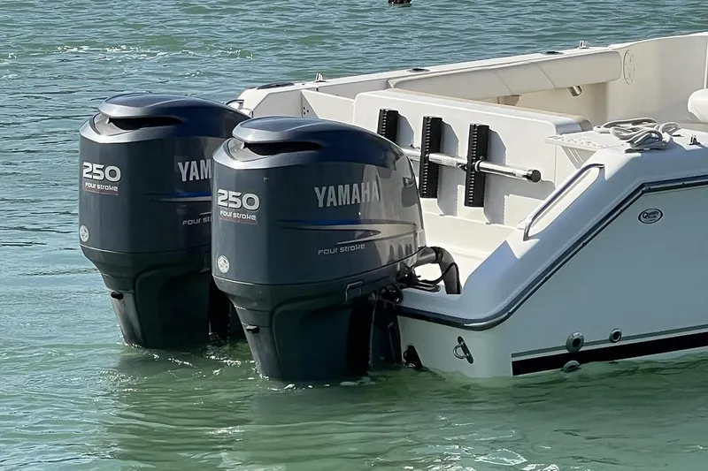 Slide: The Image of 2007 Pursuit OS 285 Offshore boat with twin Yamaha 250 outboard motors in water. - 4