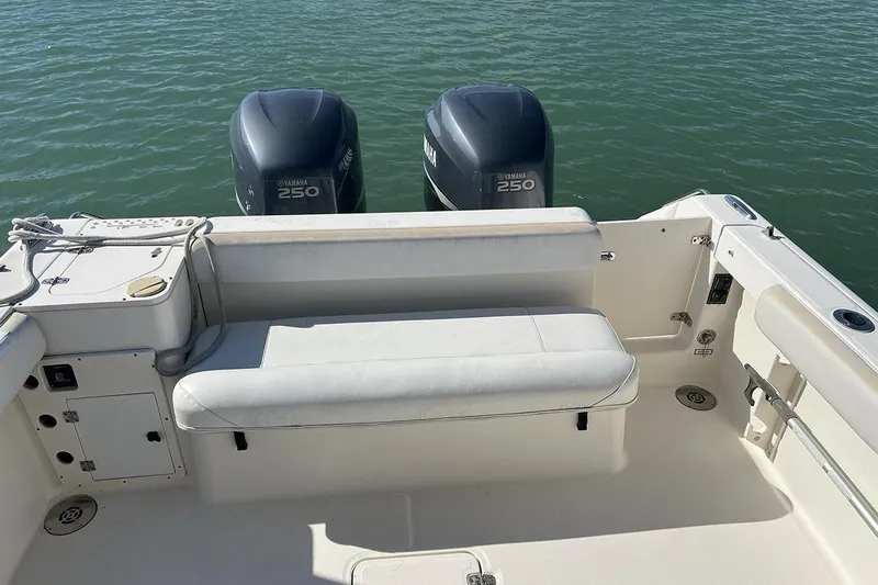 Slide: The Image of 2007 Pursuit OS 285 Offshore boat with twin Yamaha 250 engines, rear seating, and open deck. - 5