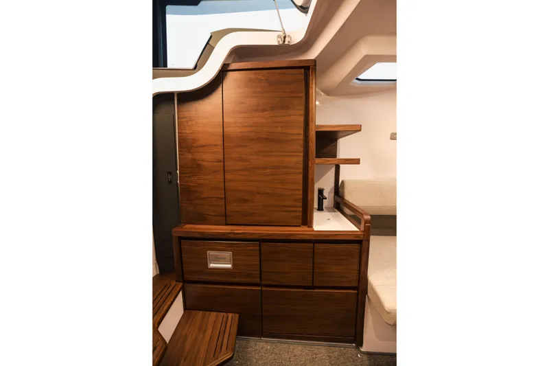 Slide: The Image of Luxurious interior of 2026 Axopar 38 Cross Cabin with elegant wood cabinetry and modern design. - 14