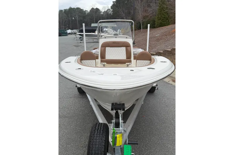 Slide: The Image of 2026 Pioneer 180 Islander boat on trailer, featuring sleek design and comfortable seating. - 2