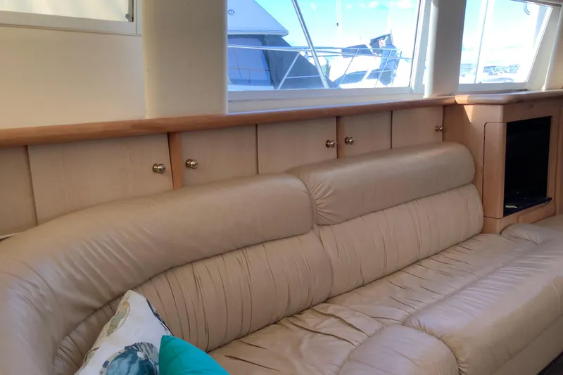 Slide: The Image of Interior of 1997 Carver 500 Cockpit Motor Yacht with beige leather seating. - 10