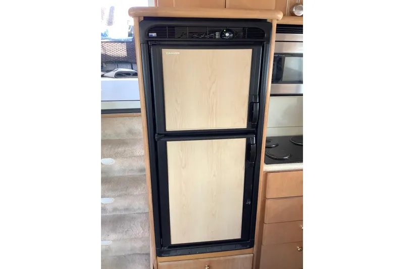 Slide: The Image of Built-in refrigerator in 1997 Carver 500 Cockpit Motor Yacht kitchen area. - 13