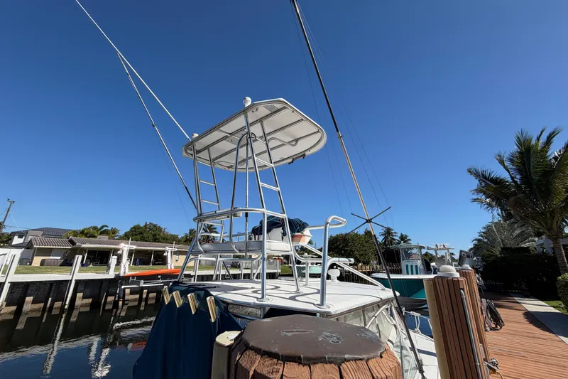 Slide: The Image of 2007 Luhrs 28 Open boat docked under clear blue sky. - 10