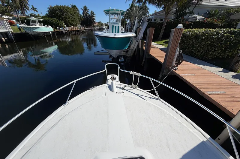 Slide: The Image of 2007 Luhrs 28 Open boat docked in a serene canal setting. - 17