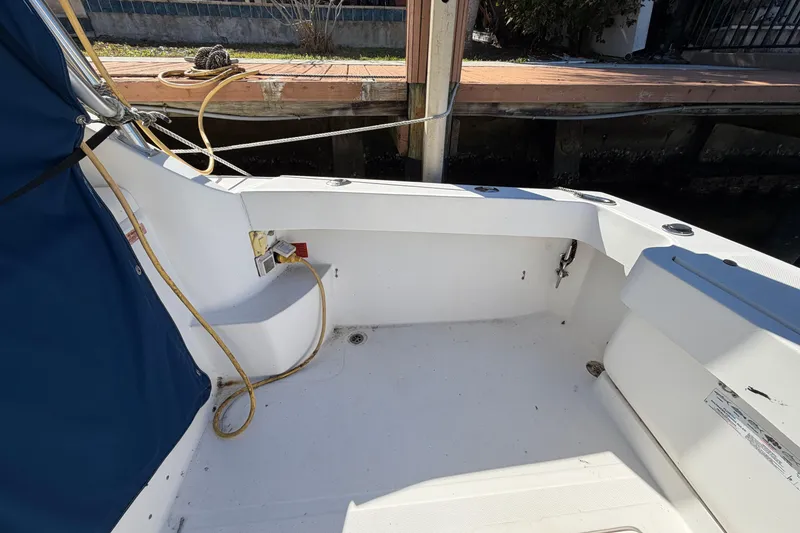 Slide: The Image of 2007 Luhrs 28 Open boat cockpit with blue cover and docked at marina. - 36