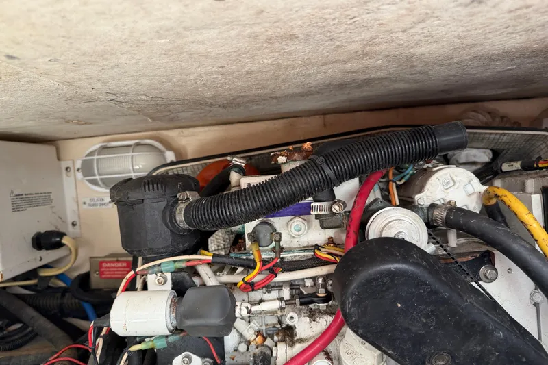 Slide: The Image of Engine compartment of a 2007 Luhrs 28 Open boat with visible wiring and components. - 42
