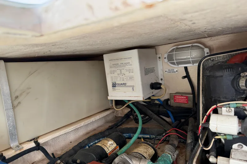 Slide: The Image of Engine compartment of 2007 Luhrs 28 Open boat with electrical components and wiring. - 44