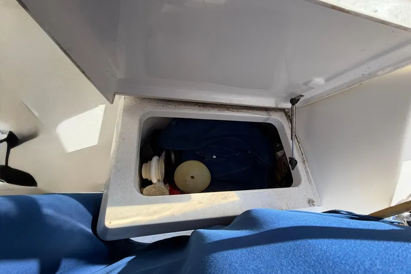 Slide: The Image of Storage compartment on a 2007 Luhrs 28 Open boat, containing various items. - 46
