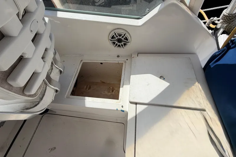 Slide: The Image of 2007 Luhrs 28 Open boat deck with storage compartment and speaker. - 48