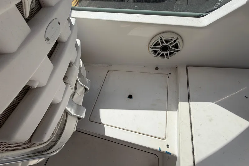 Slide: The Image of 2007 Luhrs 28 Open boat interior with storage compartment and speaker. - 50
