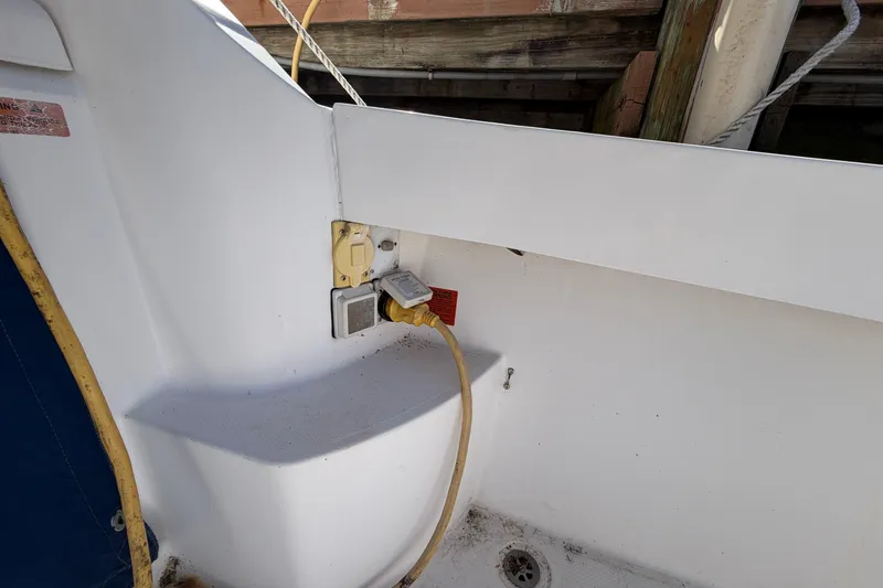 Slide: The Image of 2007 Luhrs 28 Open boat electrical outlet with yellow power cord. - 51
