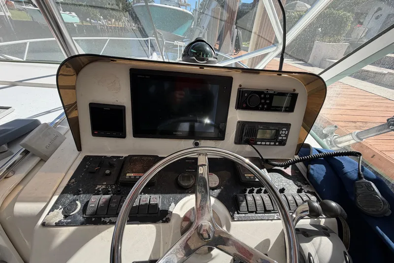 Slide: The Image of 2007 Luhrs 28 Open boat helm with navigation and communication equipment. - 57