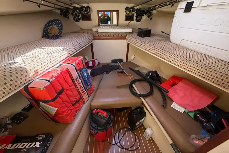 Slide: The Image of Interior of 2007 Luhrs 28 Open boat with fishing gear and life jackets. - 64