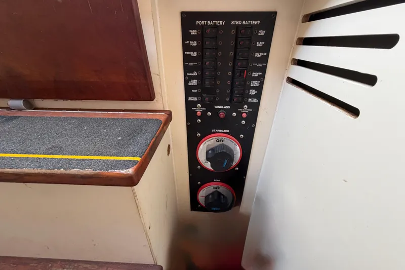 Slide: The Image of Control panel of a 2007 Luhrs 28 Open boat, featuring battery switches and circuit breakers. - 80