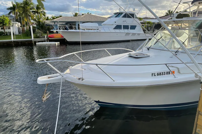 Slide: The Image of 2007 Luhrs 28 Open boat docked in a serene marina setting. - 81